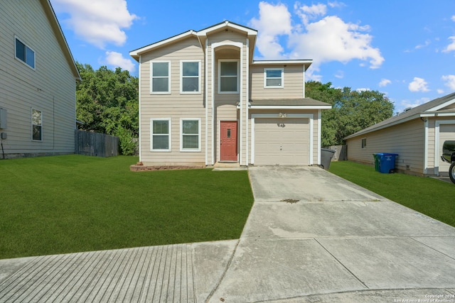 view of front of property with a garage and a front lawn