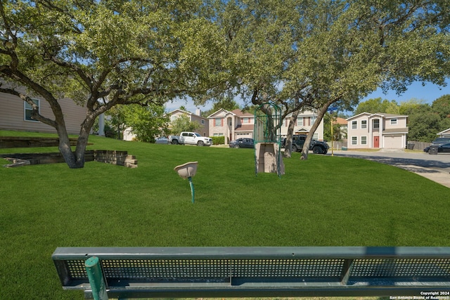 exterior space with a garage and a yard