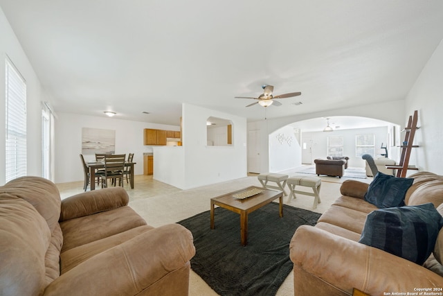 living room with ceiling fan and light carpet