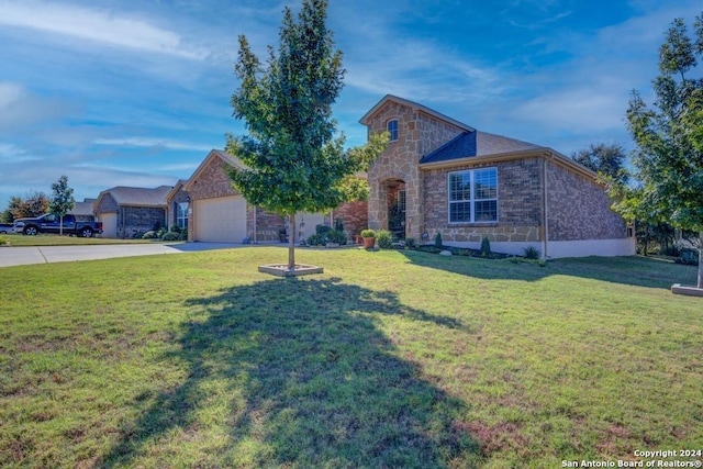 12624 Horseshoe Bay, San Antonio, TX 78253 - view of front of home featuring a front yard, an attached garage, stone siding, and driveway
