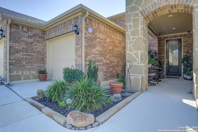 view of exterior entry featuring a garage