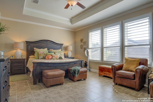 bedroom with a raised ceiling, light tile patterned floors, ornamental molding, and ceiling fan