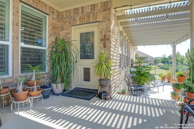 12624 Horseshoe Bay, San Antonio, TX 78253 - doorway to property featuring brick siding, fence, a patio, and a pergola