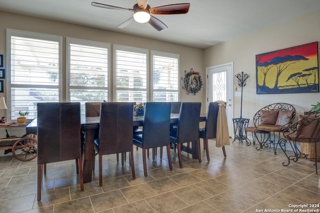 dining room featuring ceiling fan and tile patterned floors