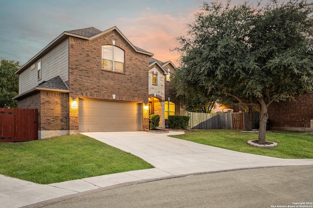 11806 Jasmine Way, San Antonio, TX 78253 - traditional home with a garage, fence, driveway, brick siding, and a yard