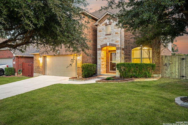 11806 Jasmine Way, San Antonio, TX 78253 - view of front facade with a garage, fence, a front yard, brick siding, and concrete driveway