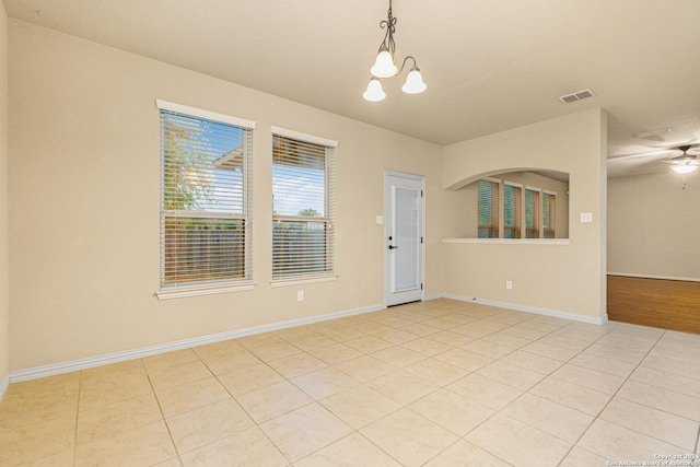 11806 Jasmine Way, San Antonio, TX 78253 - spare room with visible vents, baseboards, ceiling fan with notable chandelier, and light tile patterned floors