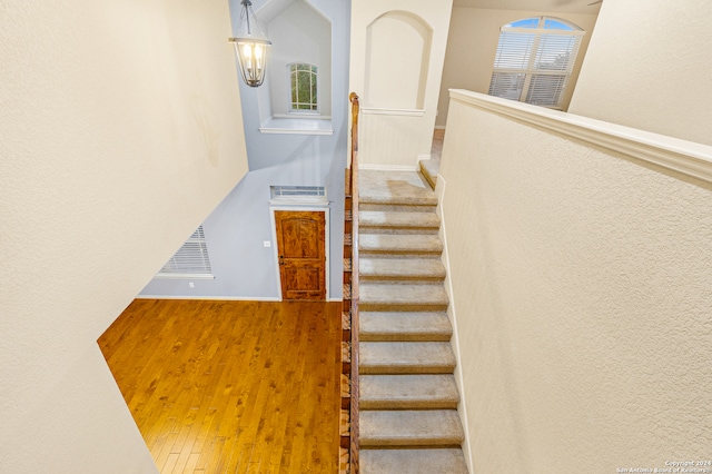 staircase featuring hardwood / wood-style floors