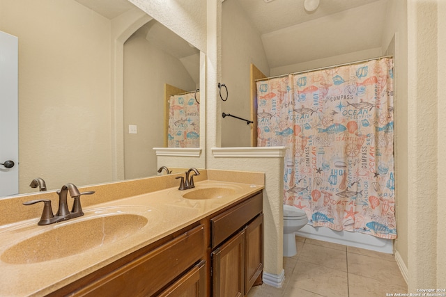 full bathroom with shower / bath combination with curtain, vanity, tile patterned flooring, and toilet