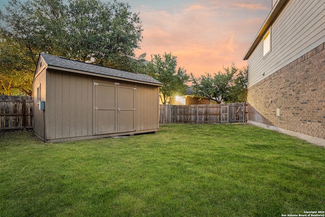 11806 Jasmine Way, San Antonio, TX 78253 - view of yard with a fenced backyard, a shed, and an outbuilding