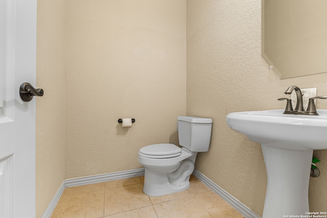 bathroom featuring tile patterned floors and toilet