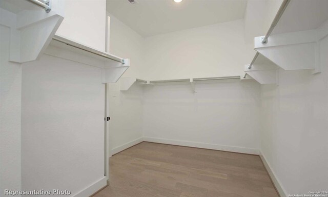 spacious closet with light wood-type flooring