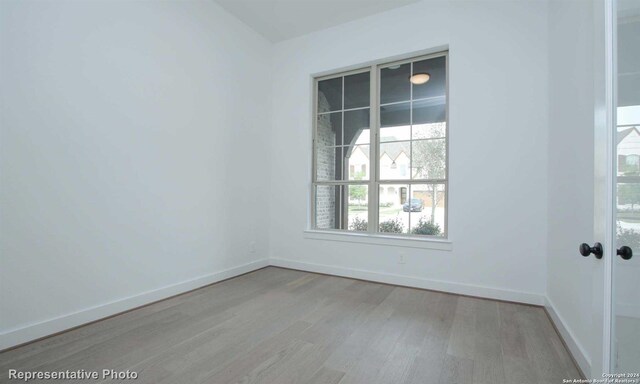 empty room with light wood-type flooring