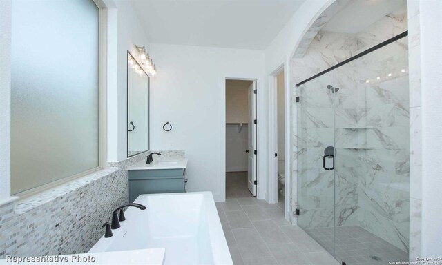 bathroom with vanity, a shower with shower door, and toilet