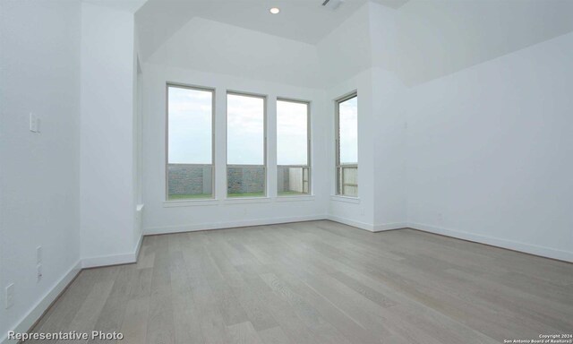 spare room with light hardwood / wood-style flooring