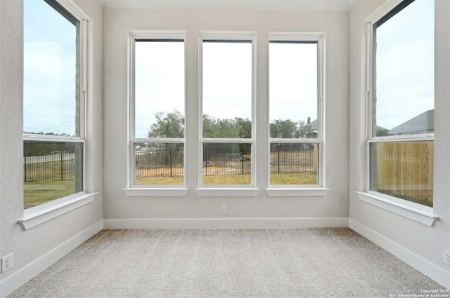 unfurnished sunroom featuring plenty of natural light