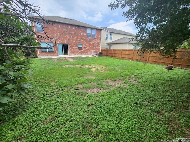 view of yard with central AC unit