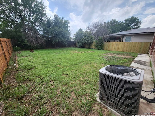 view of yard with central AC