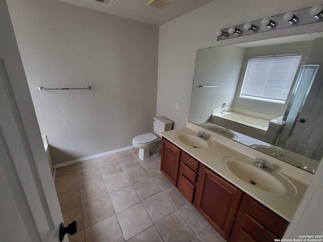 full bathroom featuring shower with separate bathtub, vanity, toilet, and tile patterned floors