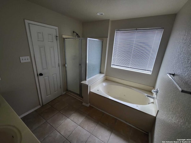 bathroom featuring sink, tile patterned floors, and separate shower and tub