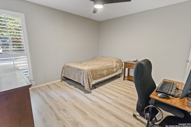 bedroom with ceiling fan and light hardwood / wood-style flooring