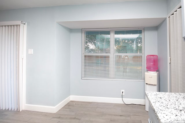 unfurnished dining area with light hardwood / wood-style floors