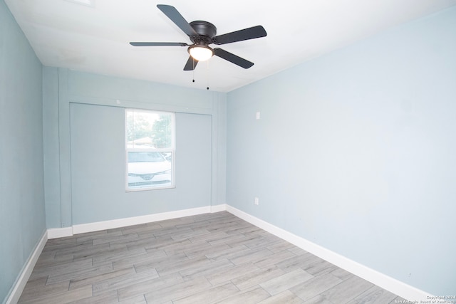 unfurnished room with light wood-type flooring and ceiling fan