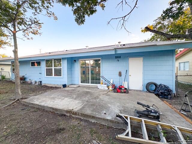 back of property featuring a patio area