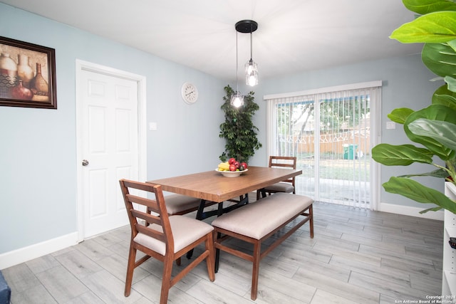 dining area featuring light wood-type flooring