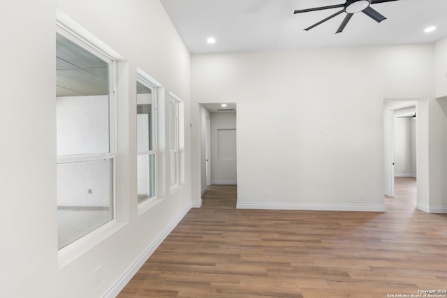 spare room with wood-type flooring and ceiling fan