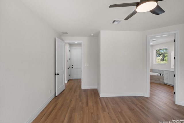 spare room featuring ceiling fan and light hardwood / wood-style floors