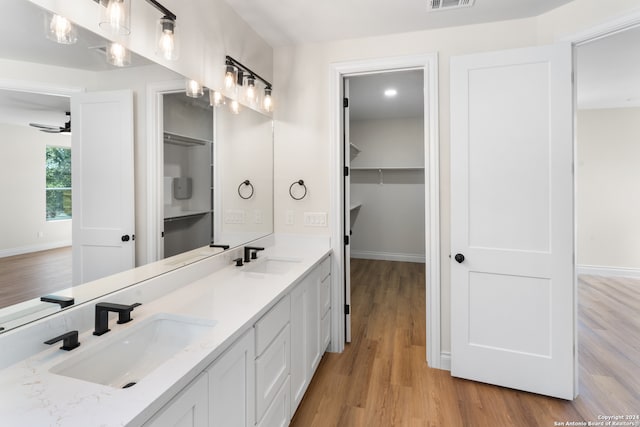 bathroom featuring vanity, ceiling fan, and hardwood / wood-style flooring