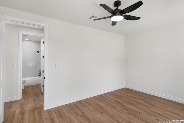 spare room featuring light hardwood / wood-style floors and ceiling fan