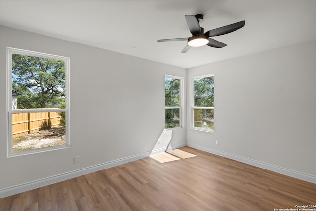 unfurnished room featuring ceiling fan and light hardwood / wood-style floors