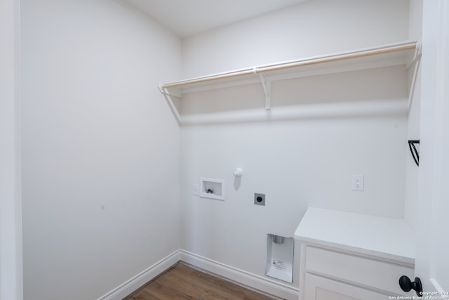 clothes washing area featuring hookup for a washing machine, dark wood-type flooring, and hookup for an electric dryer