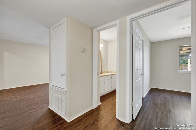 hall with dark hardwood / wood-style flooring