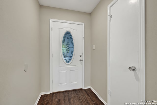 doorway with dark hardwood / wood-style flooring