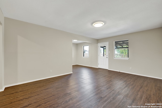 empty room featuring dark hardwood / wood-style floors