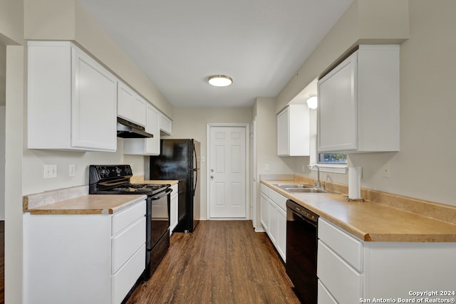 kitchen with black appliances, white cabinetry, sink, and dark wood-type flooring