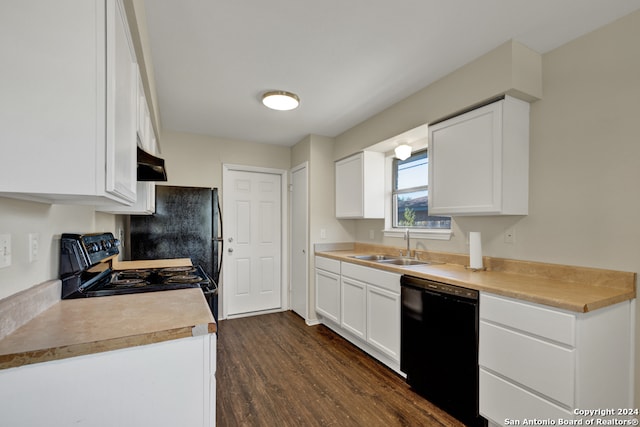 kitchen with white cabinets, black appliances, dark hardwood / wood-style floors, and sink