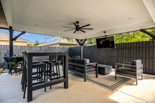 view of patio / terrace with an outdoor living space and ceiling fan