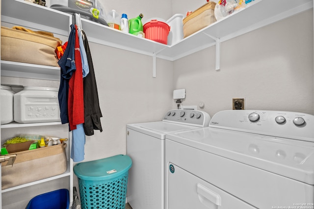 clothes washing area featuring independent washer and dryer