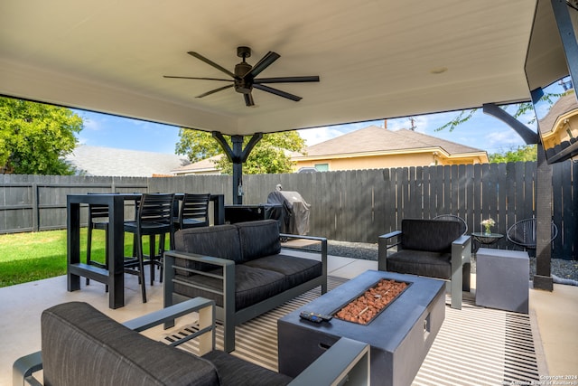 view of patio featuring grilling area, ceiling fan, and an outdoor hangout area