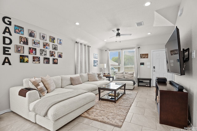 tiled living room with ceiling fan