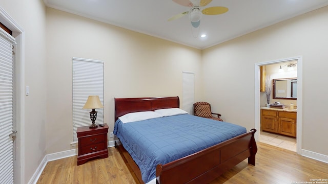 bedroom featuring ceiling fan, ensuite bathroom, and light hardwood / wood-style floors