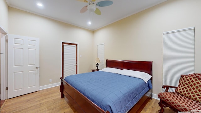 bedroom with ceiling fan, light wood-type flooring, and ornamental molding