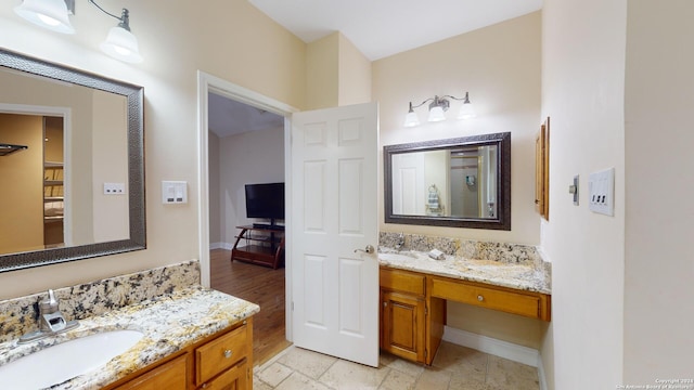 bathroom featuring vanity and hardwood / wood-style flooring