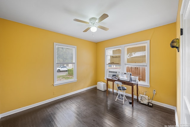 home office featuring ceiling fan and dark wood-type flooring