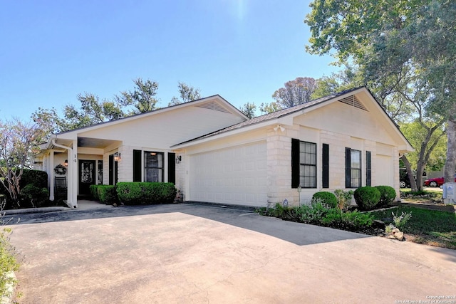 ranch-style house featuring a garage