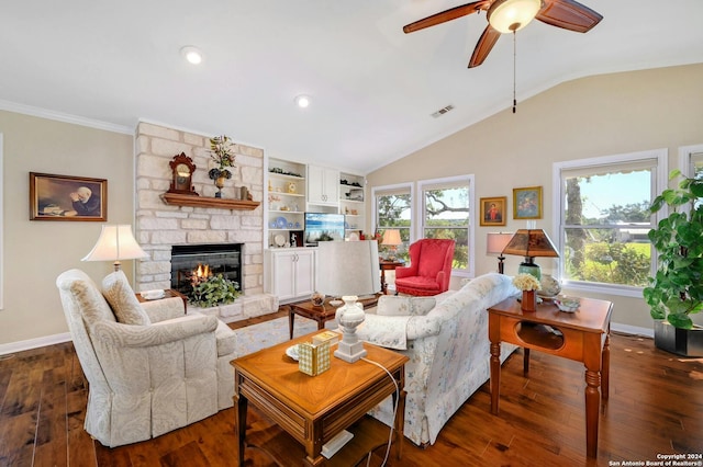 living room featuring vaulted ceiling, ceiling fan, a fireplace, and dark hardwood / wood-style flooring